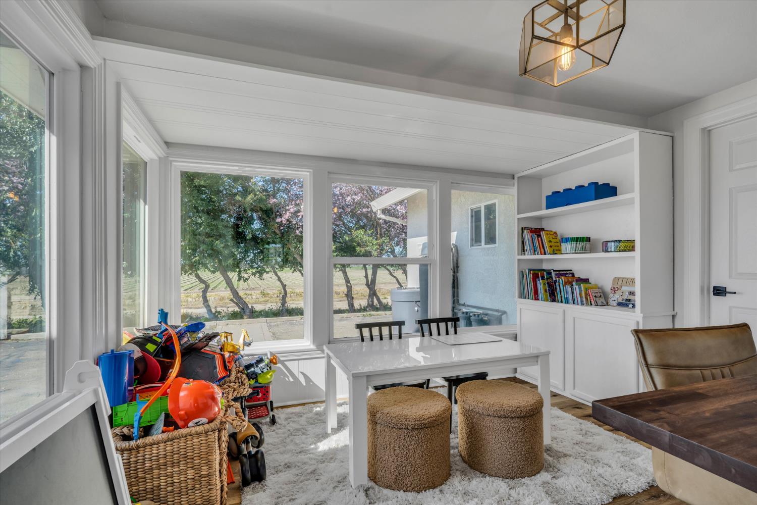6450 Delta Avenue Tracy, CA 95304 - Photo 19 of 49 a living room with furniture and floor to ceiling windows