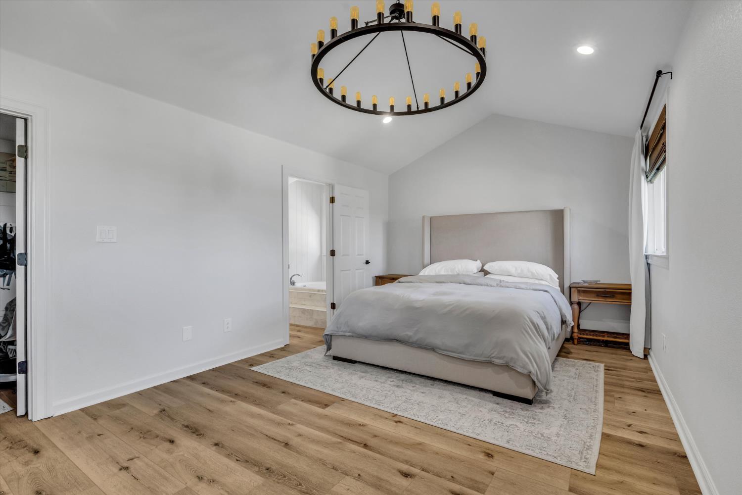 6450 Delta Avenue Tracy, CA 95304 - Photo 22 of 49 a bedroom with a bed and a chandelier