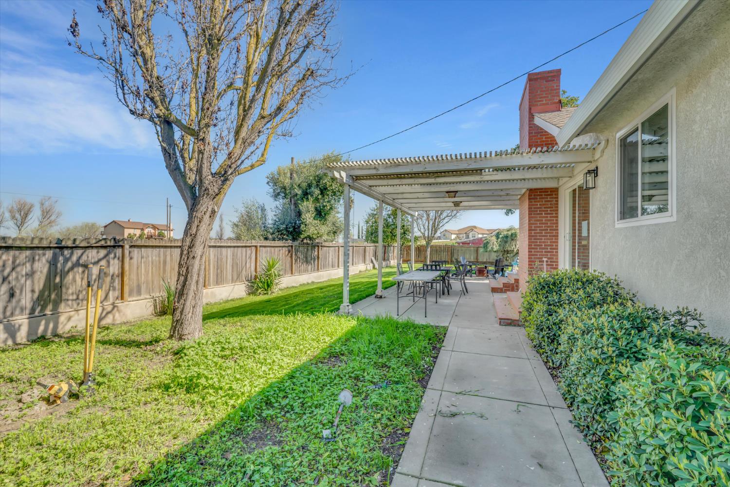 6450 Delta Avenue Tracy, CA 95304 - Photo 30 of 49 a view of a house with backyard and porch