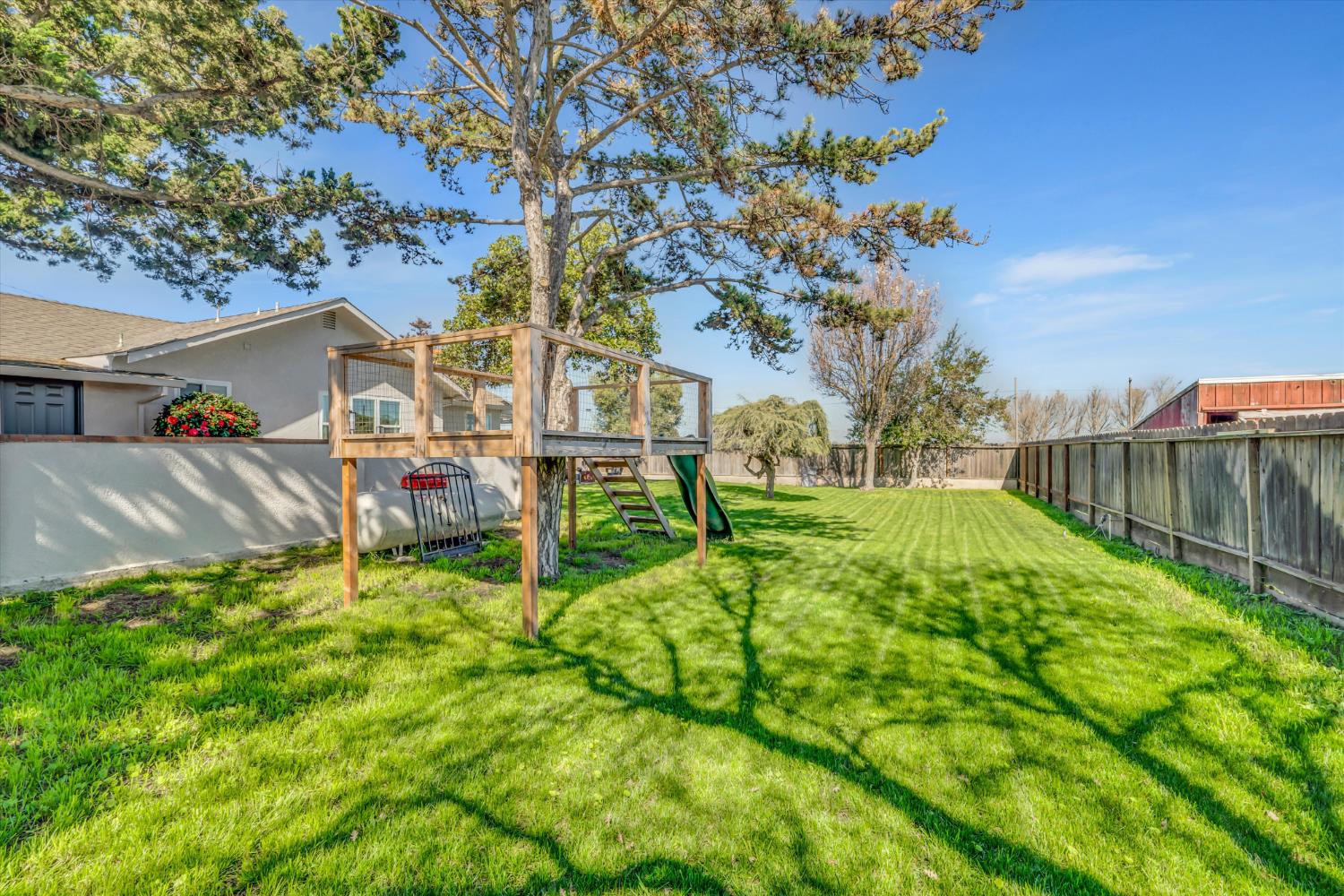 6450 Delta Avenue Tracy, CA 95304 - Photo 36 of 49 a view of backyard with swimming pool