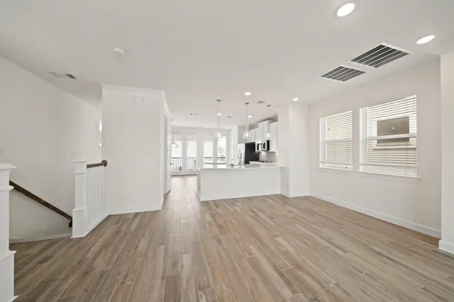 a view of kitchen and wooden floor