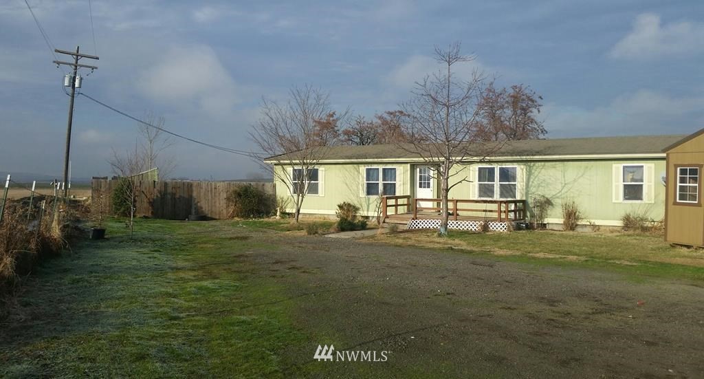 84564 Ringer Road Milton Freewater, OR 97862 - Photo 1 of 19 a front view of a house with a garden