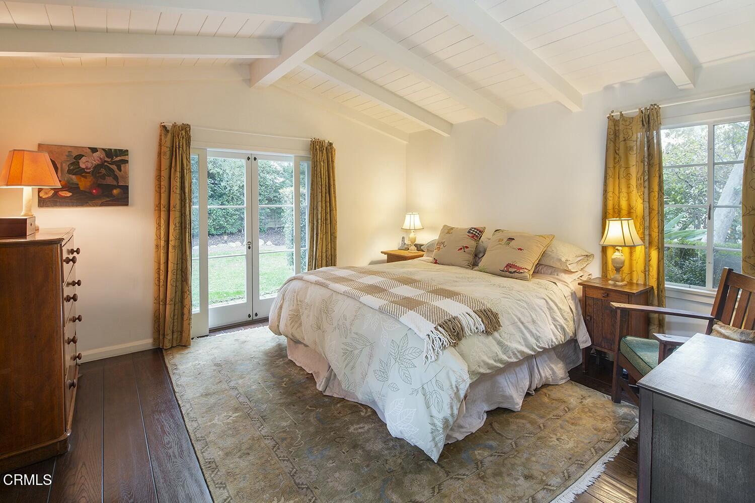 1126 Wotkyns Drive Pasadena, CA 91103 - Photo 12 of 31 a bedroom with a bed and wooden floor