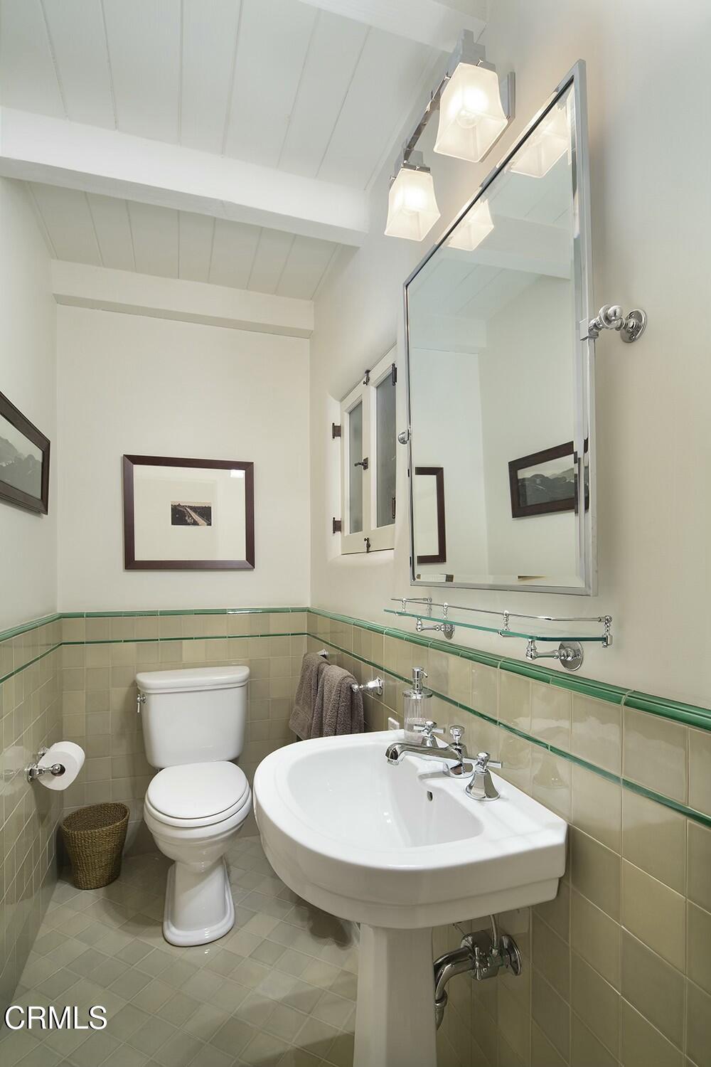 1126 Wotkyns Drive Pasadena, CA 91103 - Photo 17 of 31 a bathroom with a toilet sink and mirror