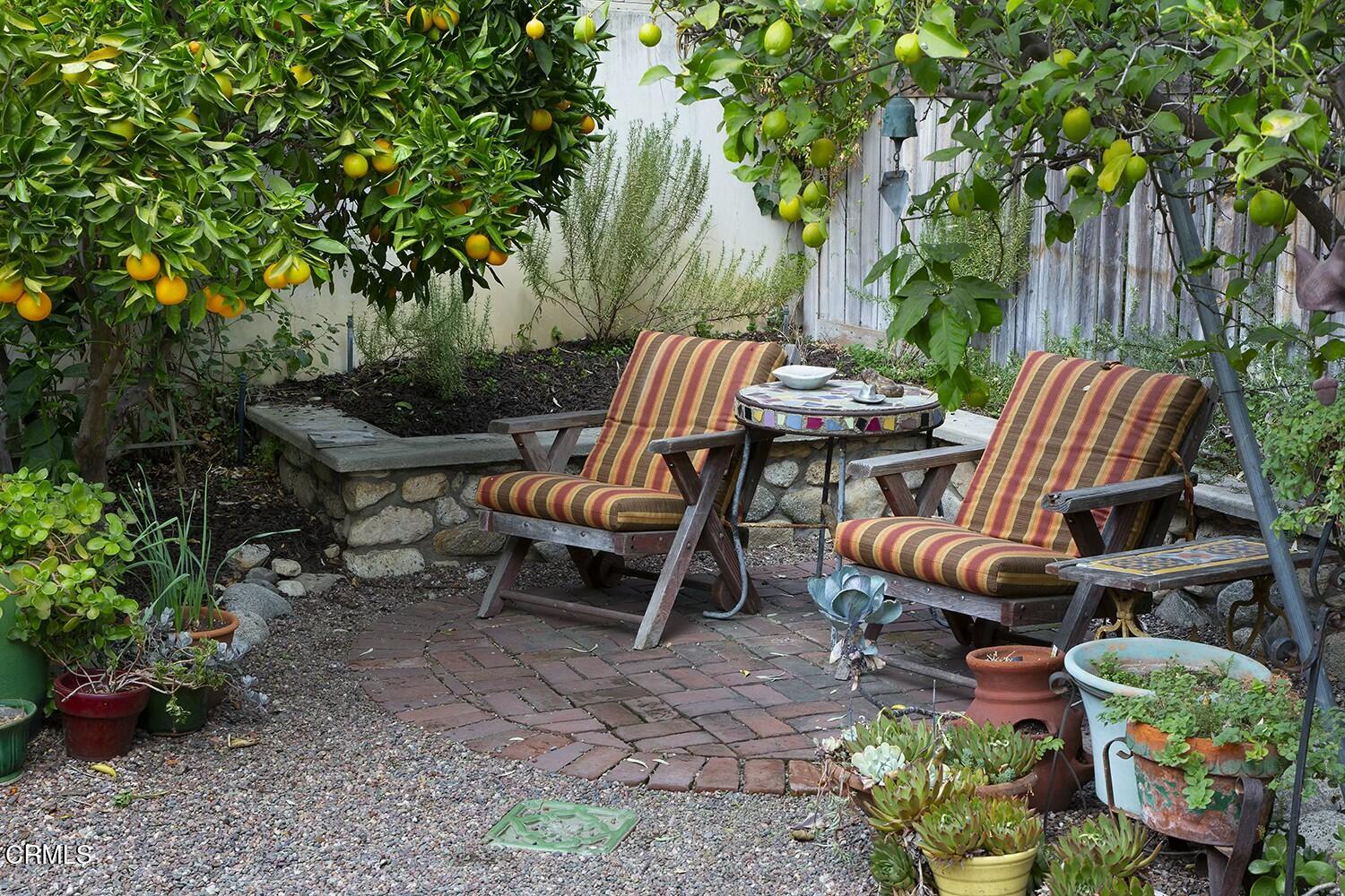 1126 Wotkyns Drive Pasadena, CA 91103 - Photo 26 of 31 a view of a backyard with sitting area and furniture