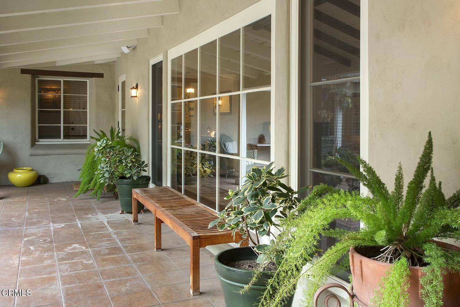 1126 Wotkyns Drive Pasadena, CA 91103 - Photo 27 of 31 a view of a chairs and table in the porch