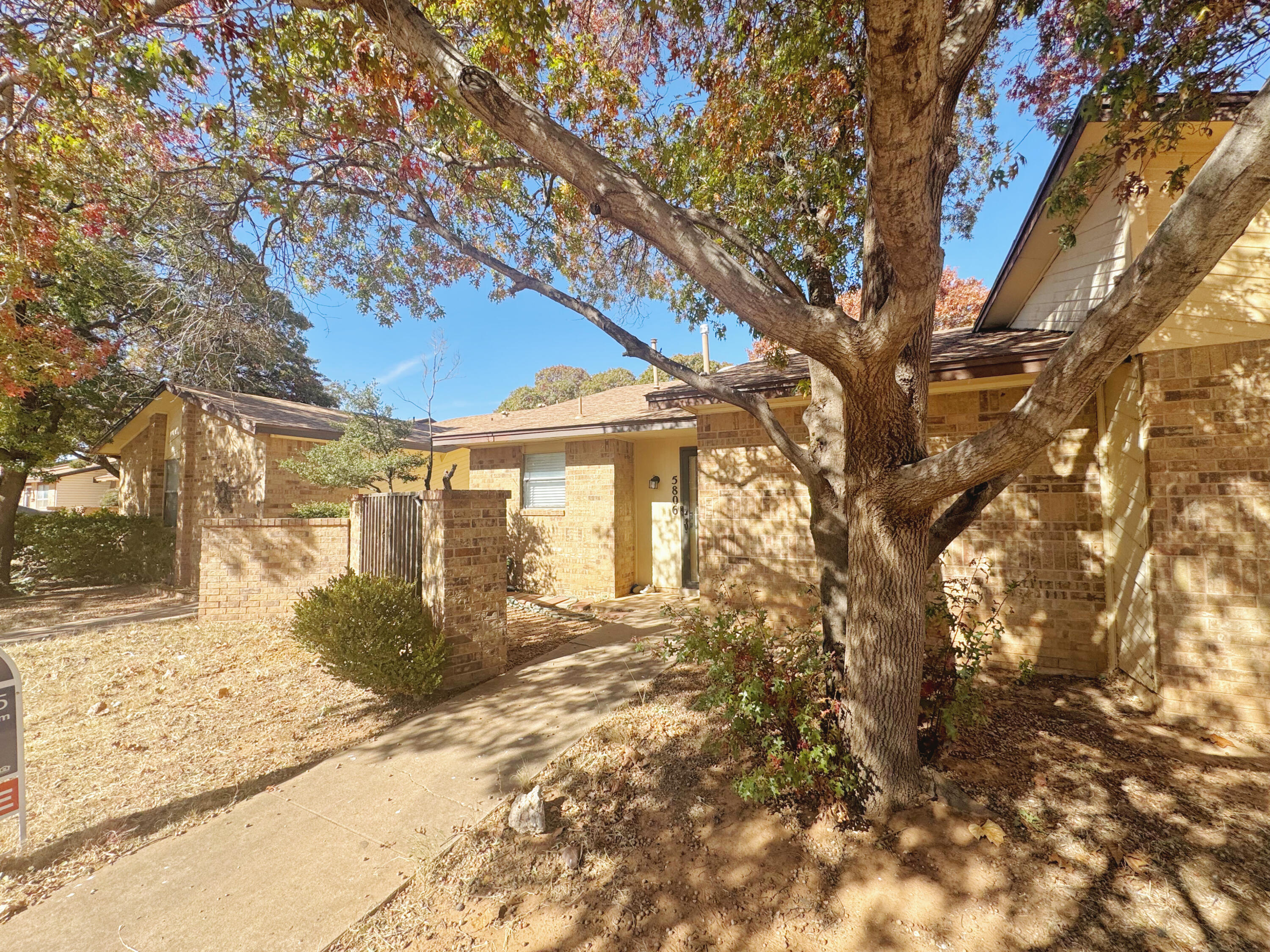 5806 7th Street Lubbock, TX 79416 - Photo 3 of 26 a front view of a house with a yard