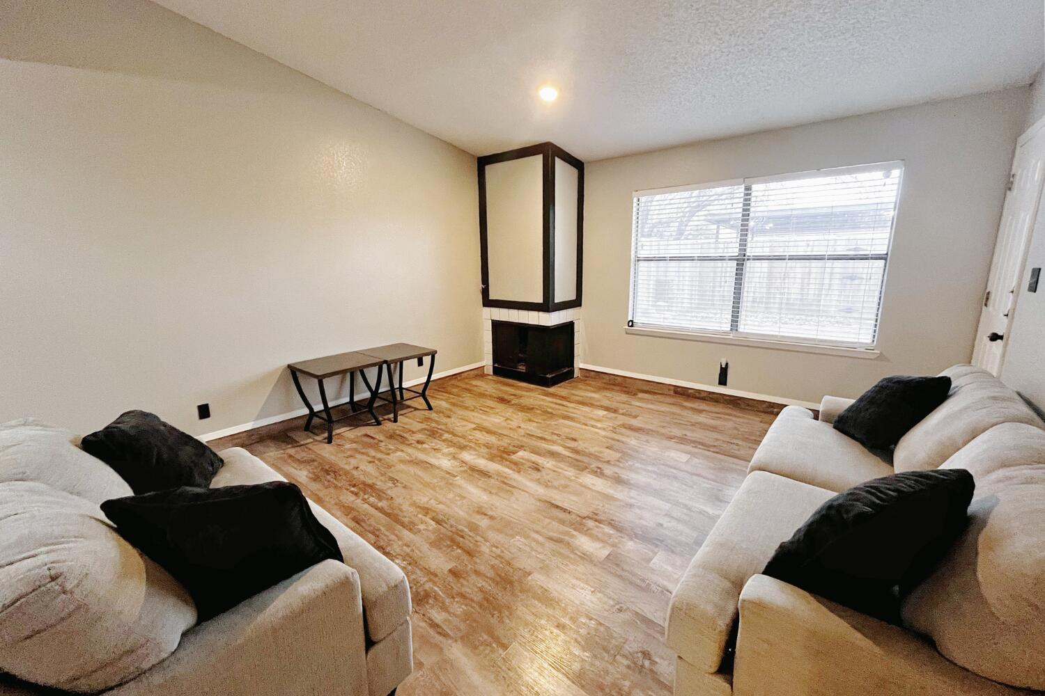 5806 7th Street Lubbock, TX 79416 - Photo 5 of 26 a bedroom with a bed window and couch