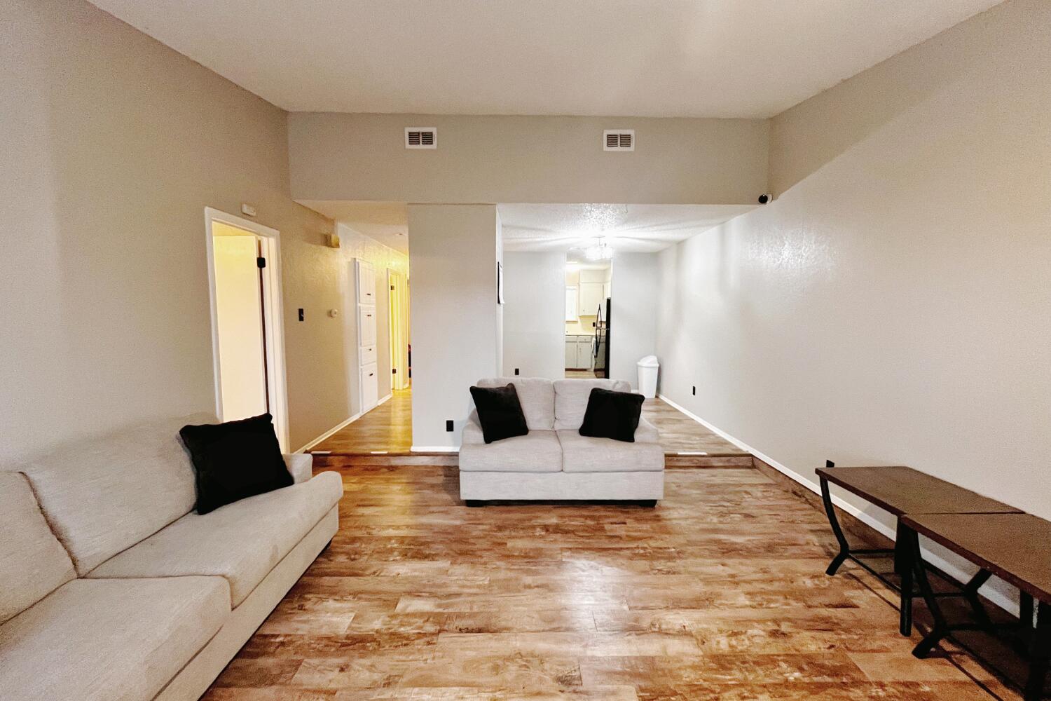 5806 7th Street Lubbock, TX 79416 - Photo 8 of 26 a living room with furniture and wooden floor
