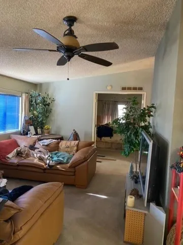 a bedroom with a bed and a mirror