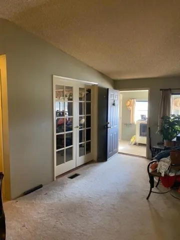 a kitchen with a sink and a refrigerator