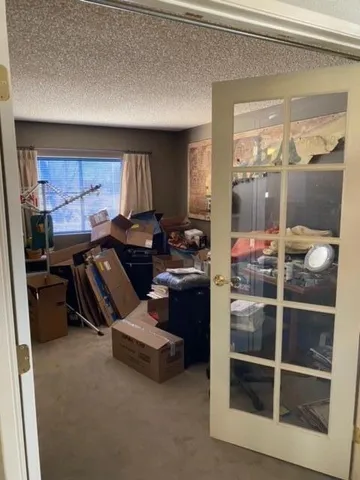 a kitchen with a refrigerator and a stove top oven