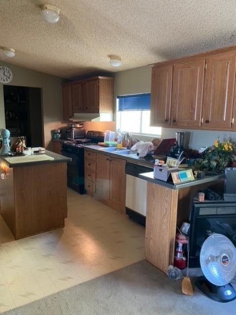 24101 Rice Road Desert Center, CA 92239 - Photo 17 of 29 a kitchen with kitchen island granite countertop a sink counter top space appliances and cabinets