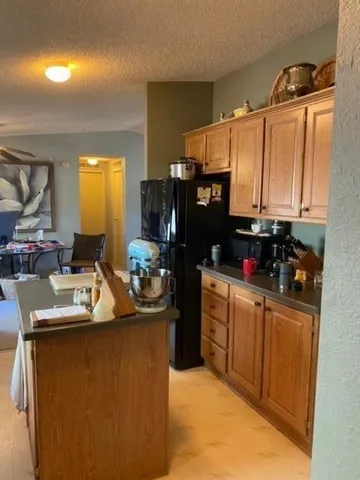 a view of a car parked in middle of a field