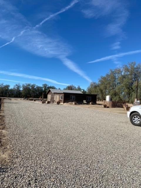 24101 Rice Road Desert Center, CA 92239 - Photo 23 of 29 a view of a car parked in middle of a field