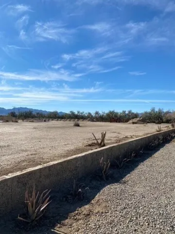 a view of a lake with houses in the back