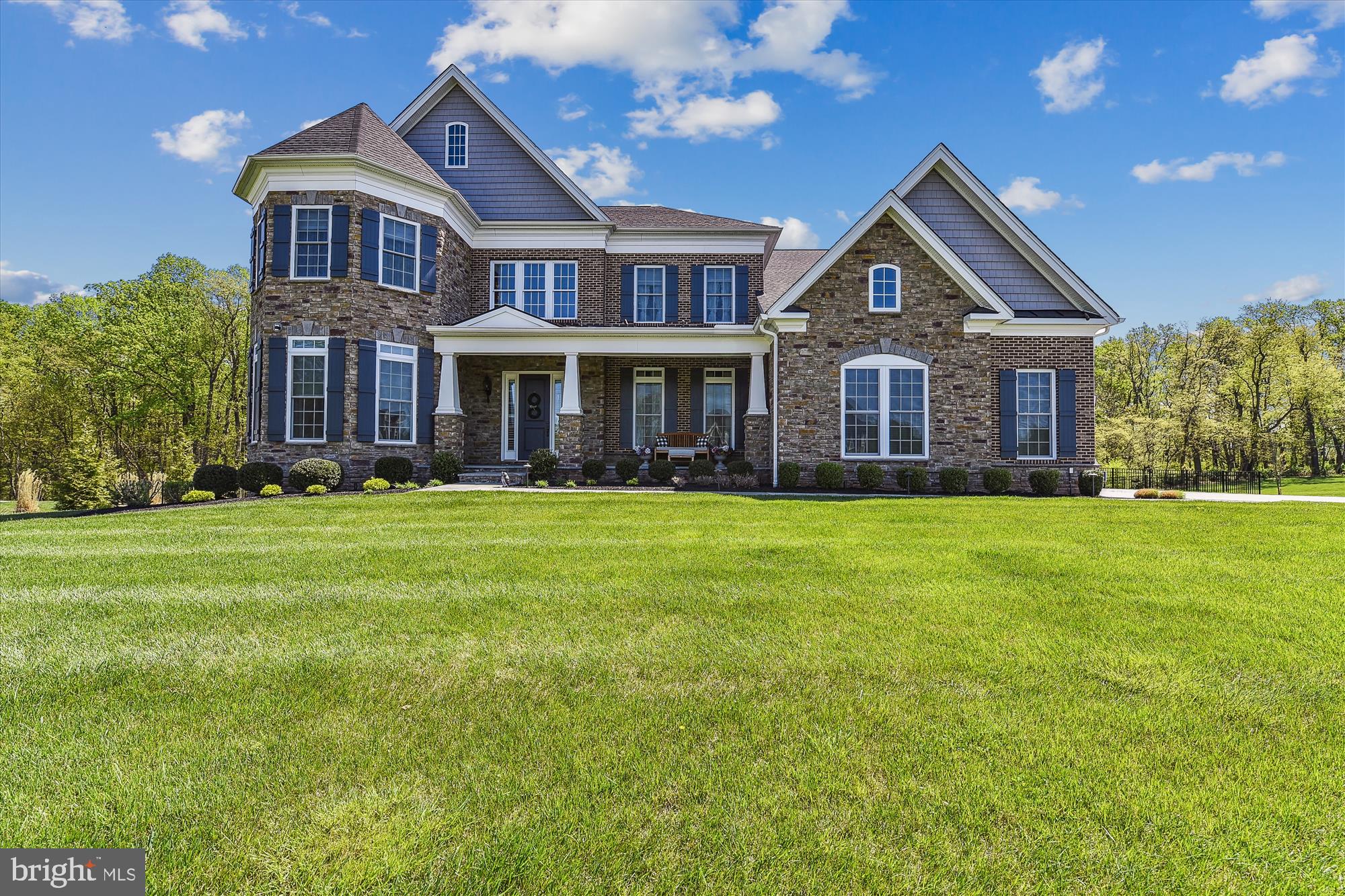 14411 Maple Ridge Court Baldwin, MD 21013 - Photo 3 of 47 a front view of a house with a yard