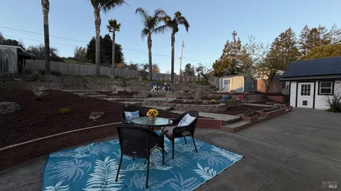 a large kitchen with stainless steel appliances lots of counter space and a sink