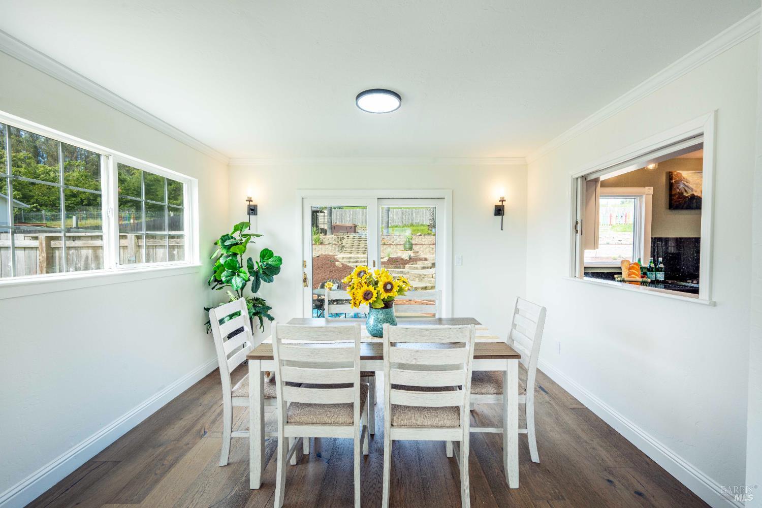 2693 Bloomfield Road Sebastopol, CA 95472 - Photo 17 of 61 a view of a dining room with furniture and a potted plant