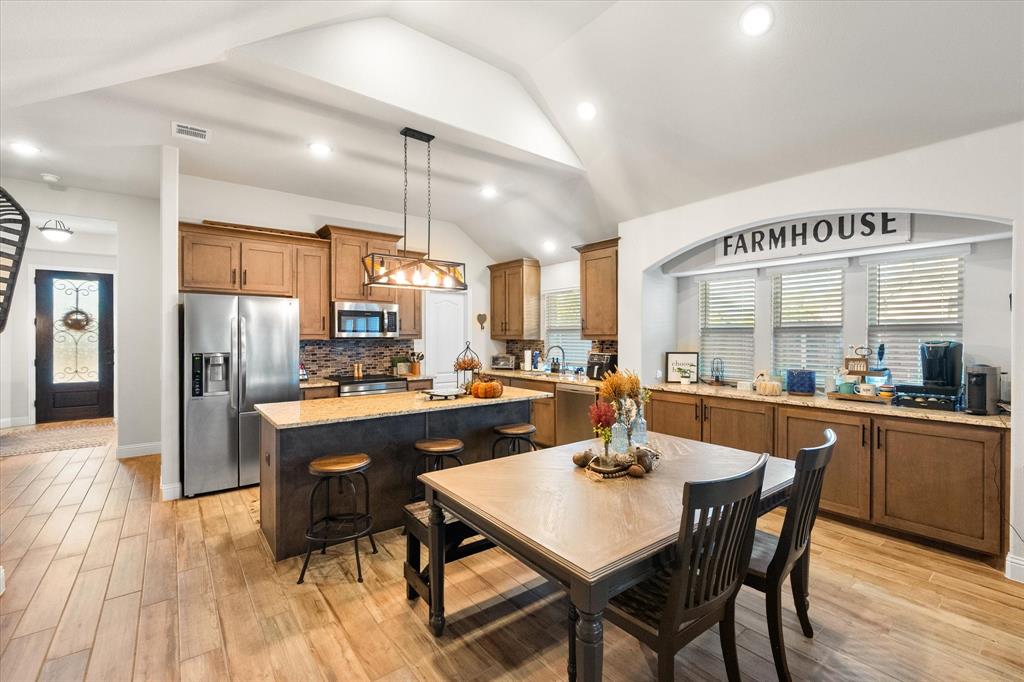 4021 Grove Valley Road Midlothian, TX 76065 - Photo 16 of 27 Dining area featuring lofted ceiling, light wood-style floors, and recessed lighting