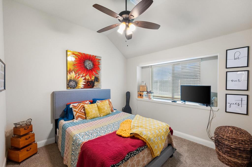 4021 Grove Valley Road Midlothian, TX 76065 - Photo 19 of 27 Bedroom featuring carpet flooring, vaulted ceiling, and ceiling fan