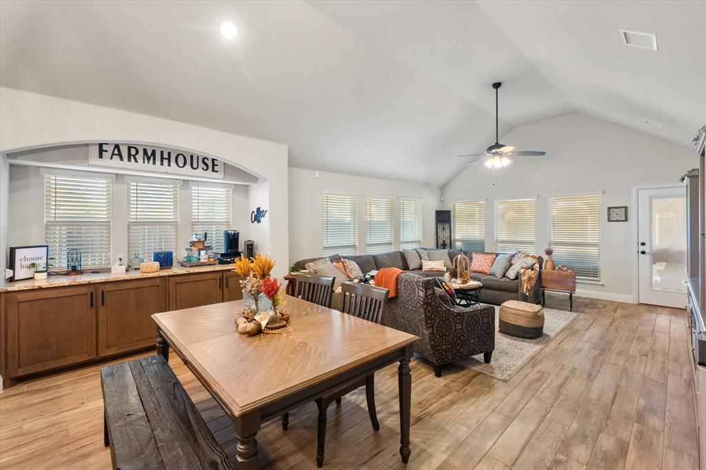 4021 Grove Valley Road Midlothian, TX 76065 - Photo 2 of 27 Dining space with light wood-type flooring, a ceiling fan, and high vaulted ceiling