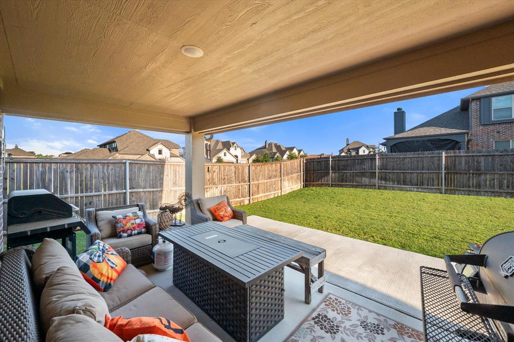 4021 Grove Valley Road Midlothian, TX 76065 - Photo 6 of 27 Fenced backyard featuring outdoor lounge area, a patio area, grilling area, and a residential view