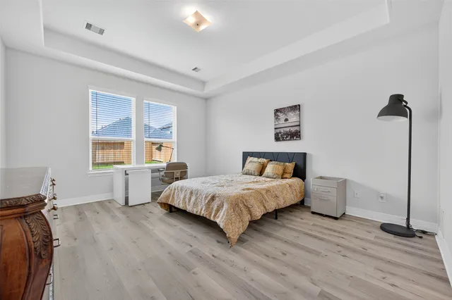 a bedroom with a bed and a table