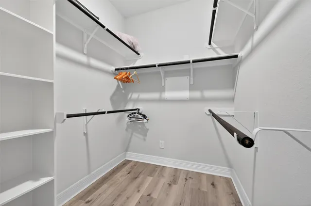 a bedroom with a bed and a table