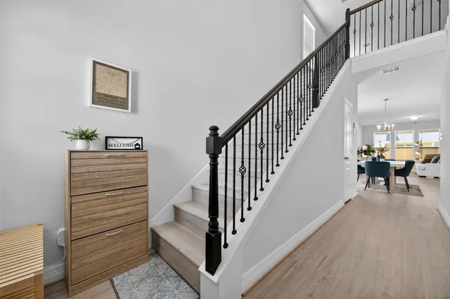 a view of a hallway with seating and stairs