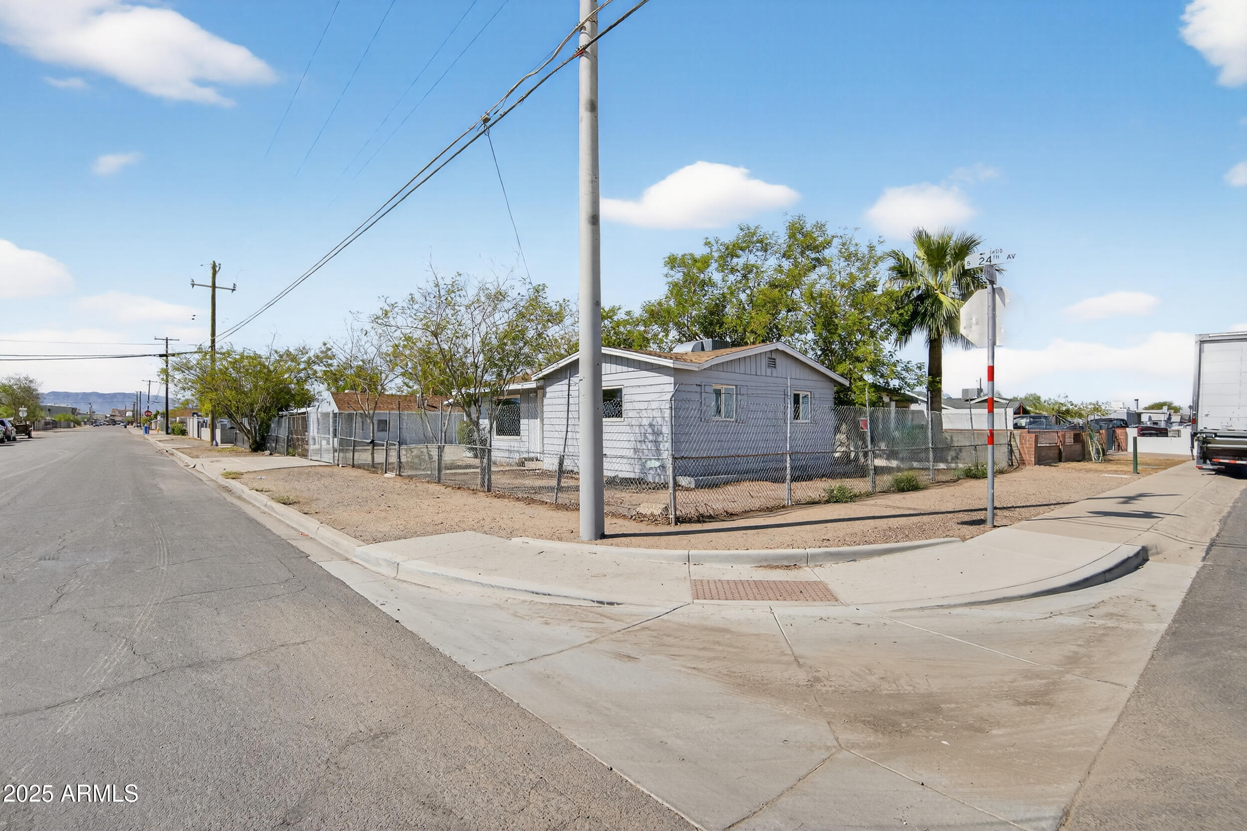 1410 South 24th Avenue, Unit A Phoenix, AZ 85009 - Photo 34 of 36 a view of a street with houses