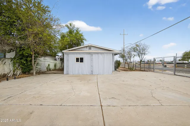 a view of a house with a yard and garage