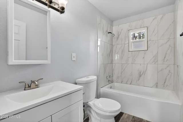 a bathroom with a sink toilet and a bathtub