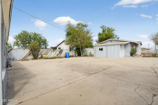 a view of a house with a yard and garage