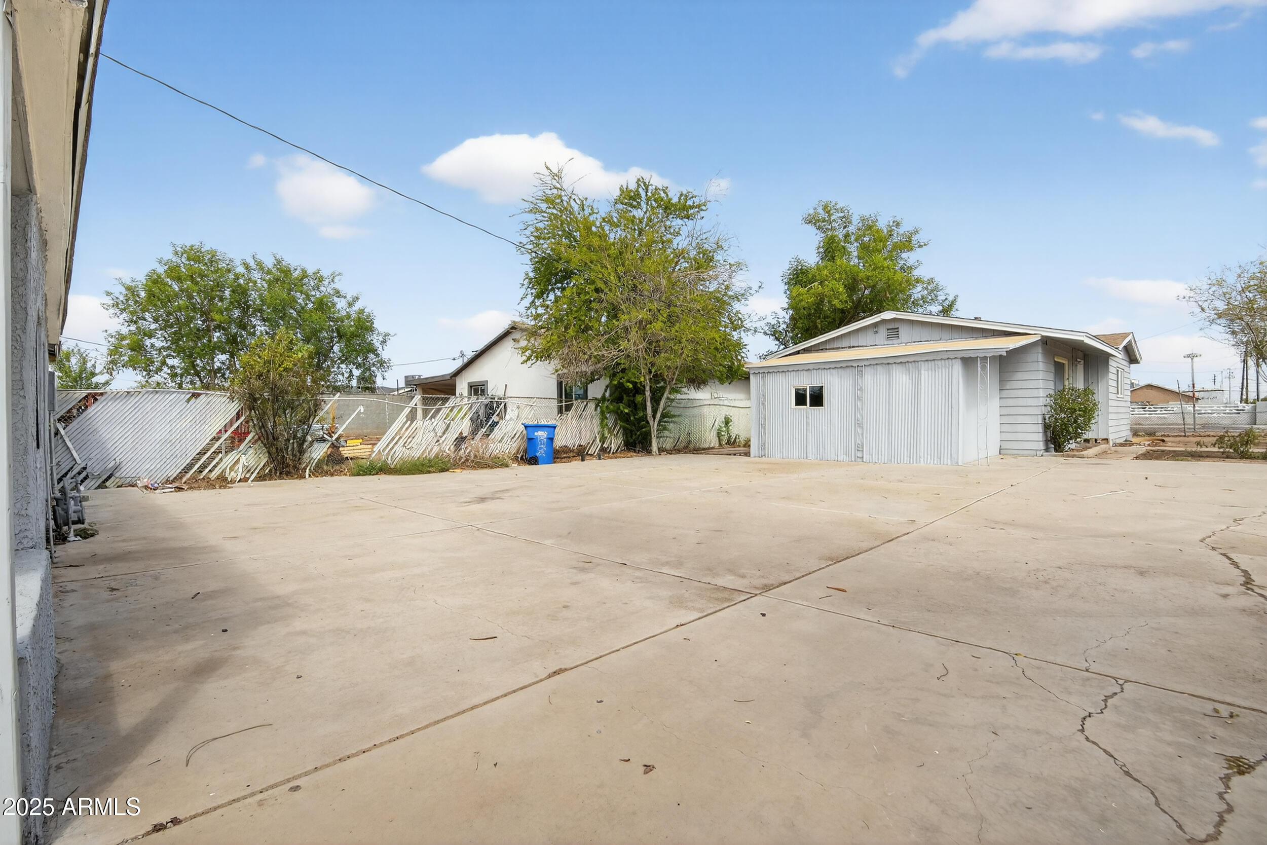 1410 South 24th Avenue, Unit A Phoenix, AZ 85009 - Photo 7 of 36 a view of a house with a yard and garage