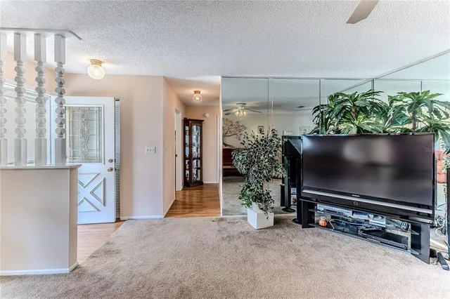 an aerial view of a house with a lake view