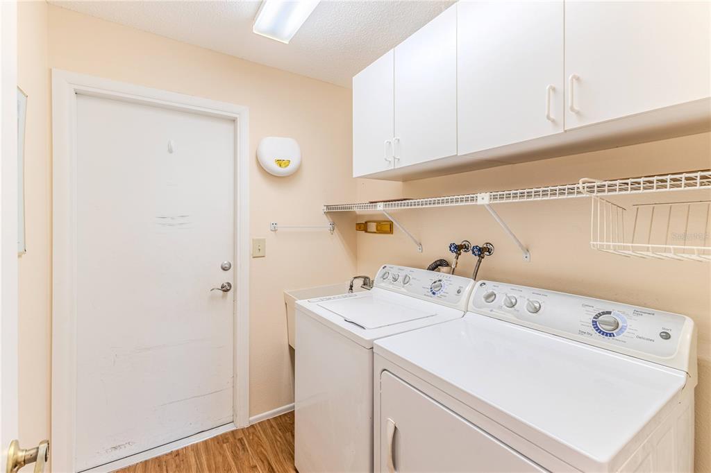 6163 Spyglass Court Spring Hill, FL 34606 - Photo 30 of 73 a utility room with dryer and washer