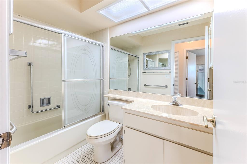 6163 Spyglass Court Spring Hill, FL 34606 - Photo 42 of 73 a bathroom with a sink a toilet and shower