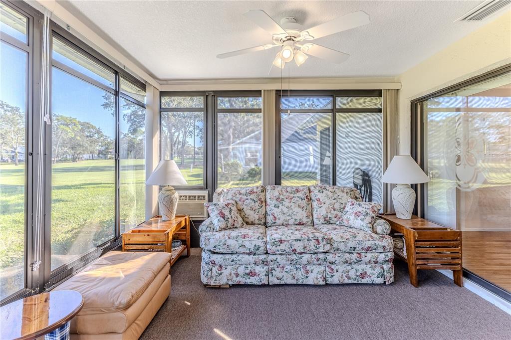 6163 Spyglass Court Spring Hill, FL 34606 - Photo 46 of 73 a living room with furniture and a large window
