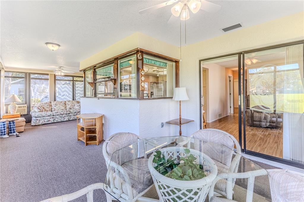 6163 Spyglass Court Spring Hill, FL 34606 - Photo 48 of 73 a living room with furniture and a large window