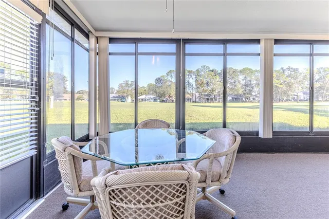 an aerial view of residential house with outdoor space and swimming pool
