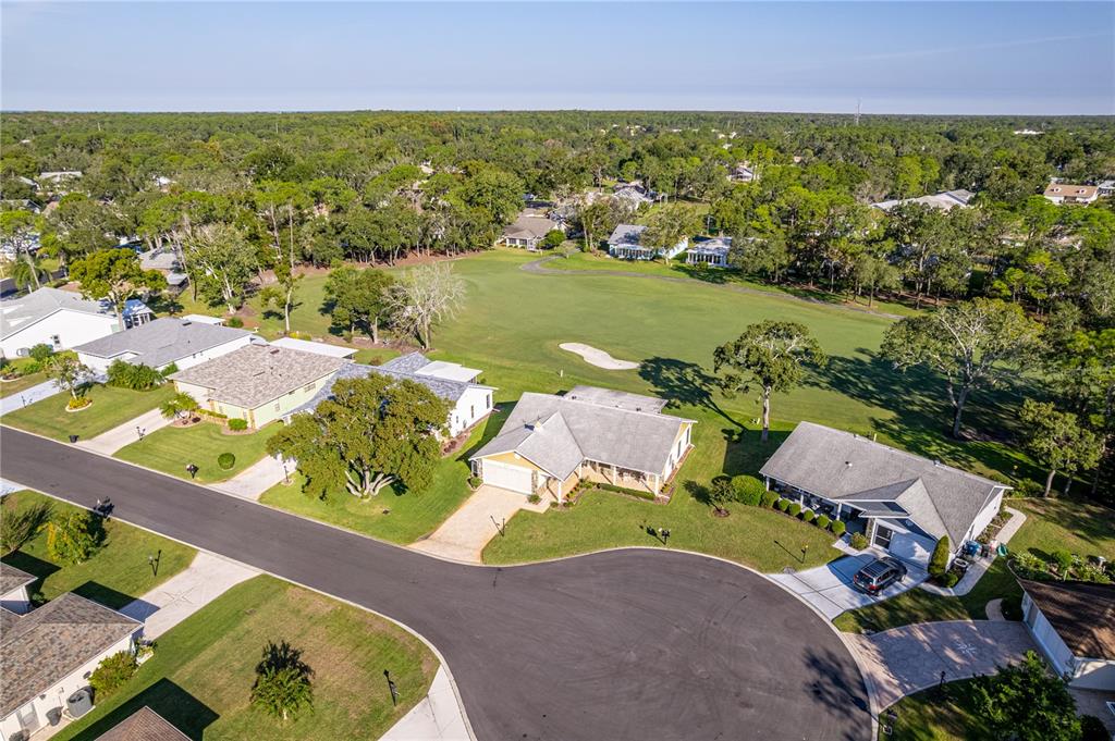 6163 Spyglass Court Spring Hill, FL 34606 - Photo 7 of 73 an aerial view of residential houses with outdoor space