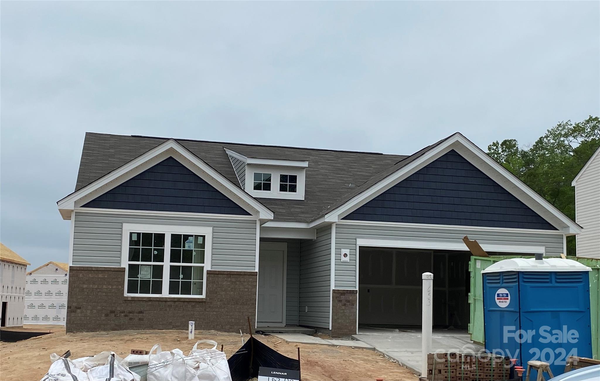 653 Mile Crk Road, Unit 93 Edgemoor, SC 29712 - Photo 1 of 14 a front view of a house with garage