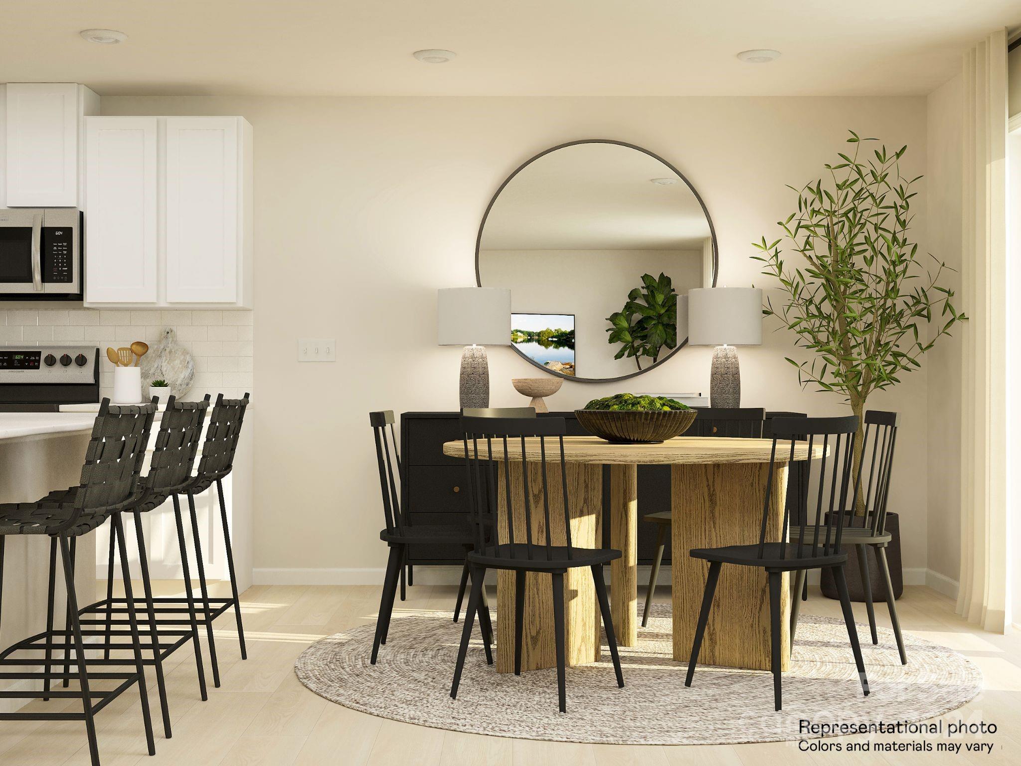 653 Mile Crk Road, Unit 93 Edgemoor, SC 29712 - Photo 7 of 14 a view of a dining room with furniture and wooden floor