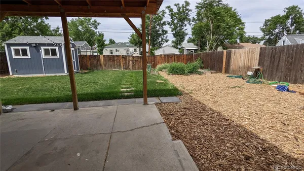 a view of backyard with green space