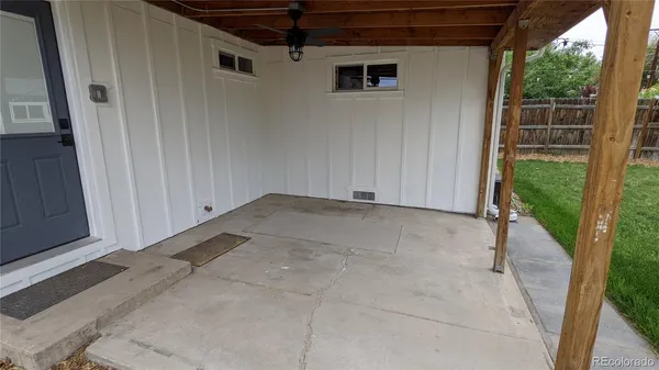 a view of a house with a yard and deck