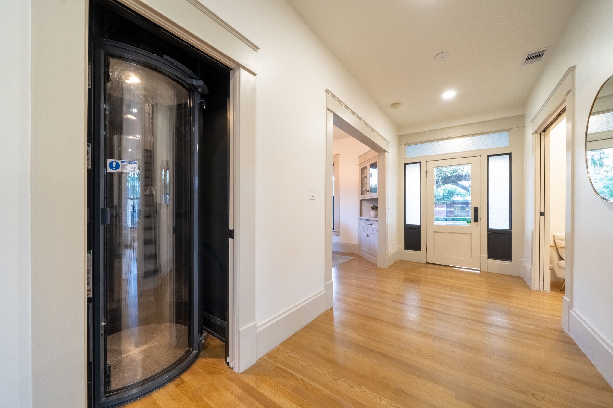 1109 Rutland Street Houston, TX 77008 - Photo 15 of 34 A sleek, space-saving pneumatic elevator perfectly positioned for effortless floor-to-floor travel. Experience smooth, whisper-quiet rides with a modern touch of luxury.