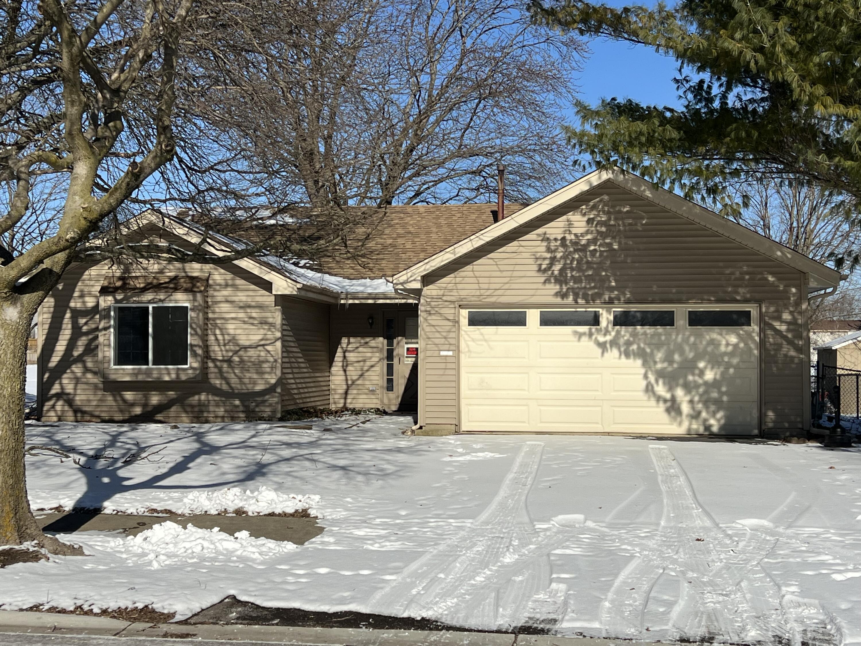 a view of a house with a snow