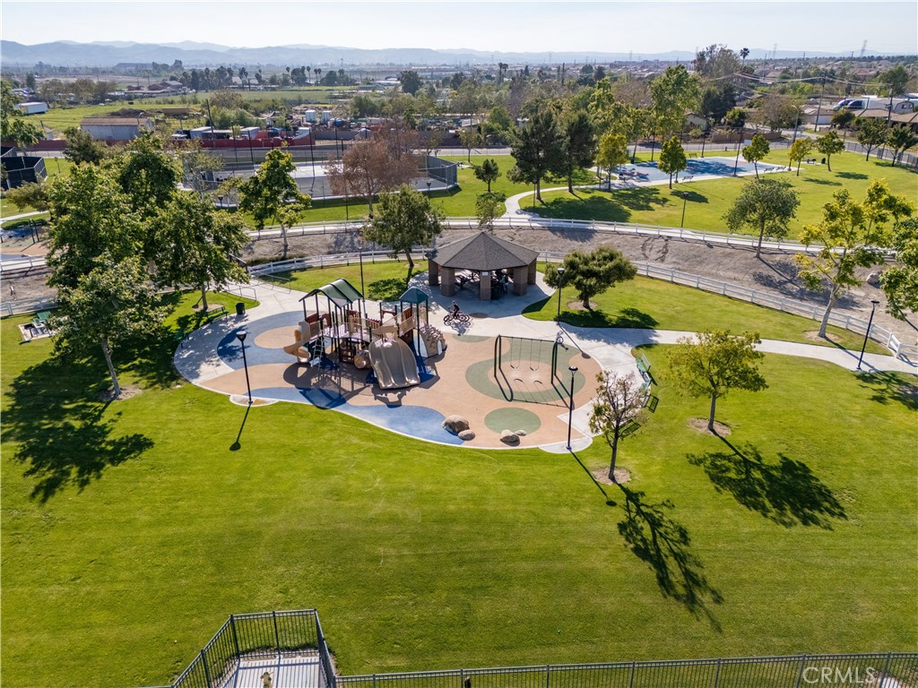 14428 Table Bluff Circle Eastvale, CA 92880 - Photo 11 of 29 a view of a swimming pool with a table and chairs