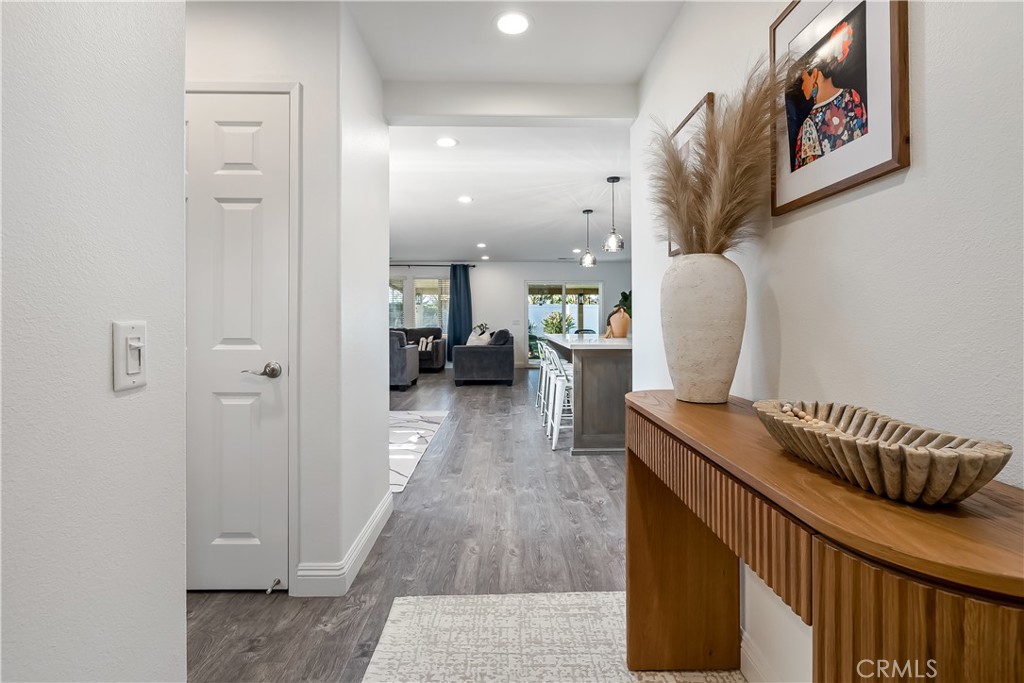 14428 Table Bluff Circle Eastvale, CA 92880 - Photo 12 of 29 a hallway with a view of living room